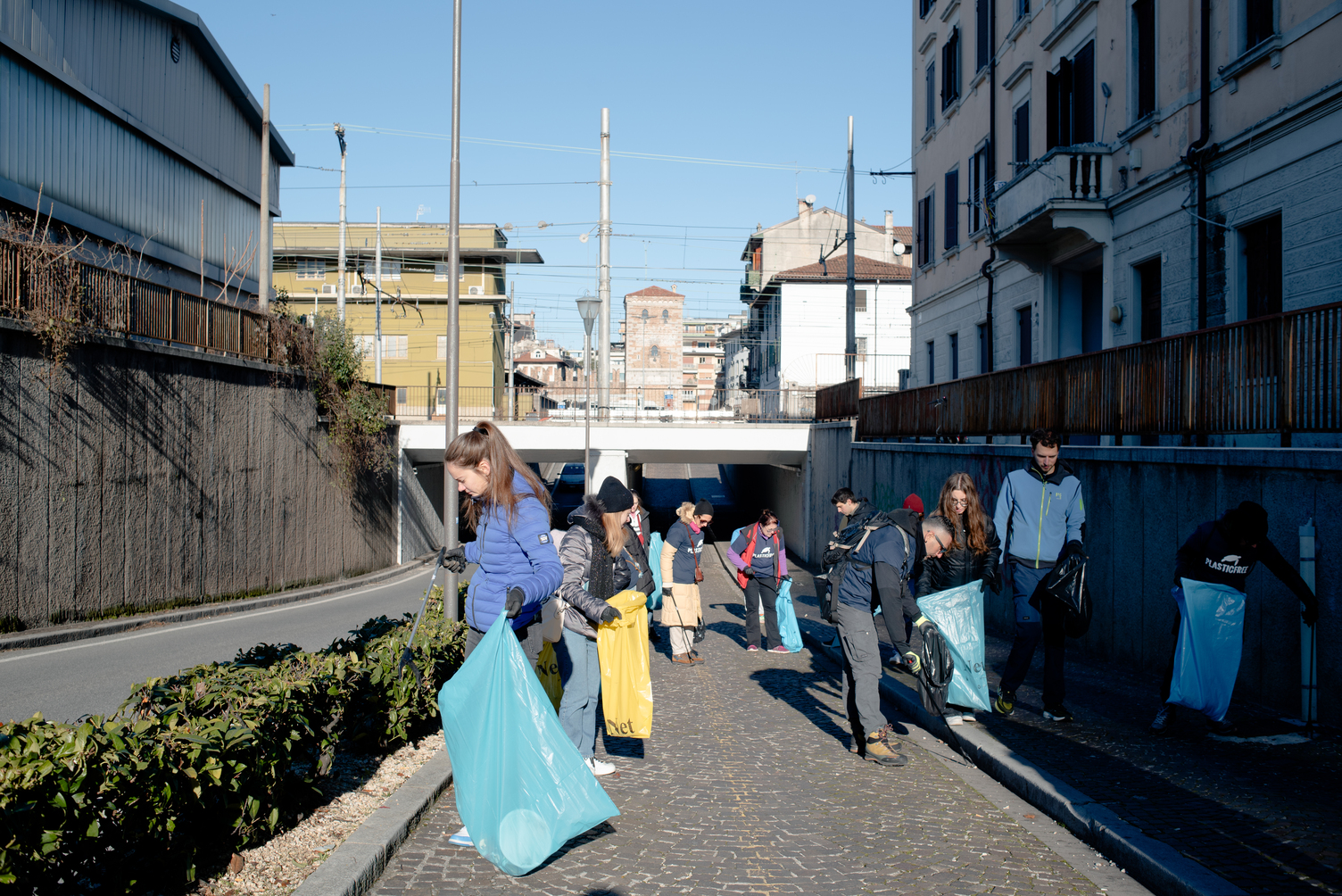a group of people cleaning up the street